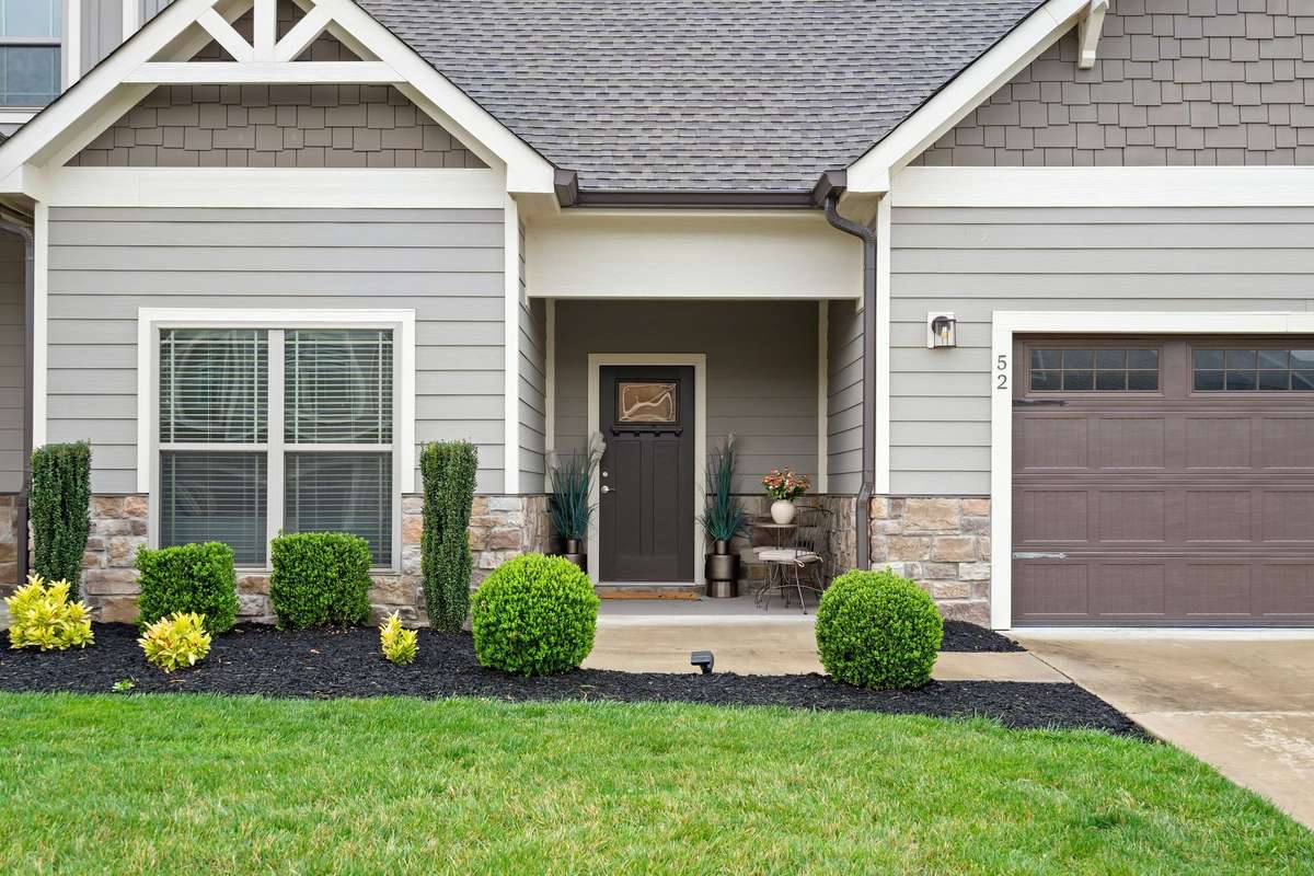Covered front porch entry offering a warm and welcoming arrival.