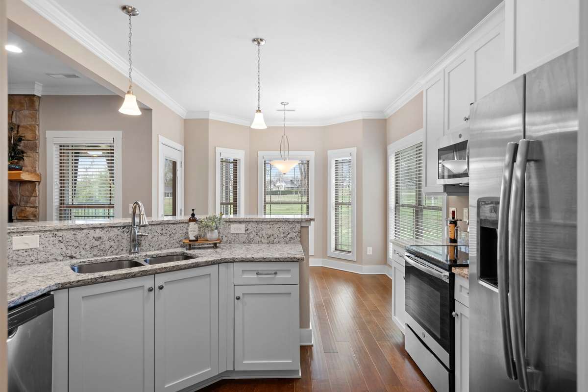 Kitchen overlooking the living room, perfect for gatherings and conversation.