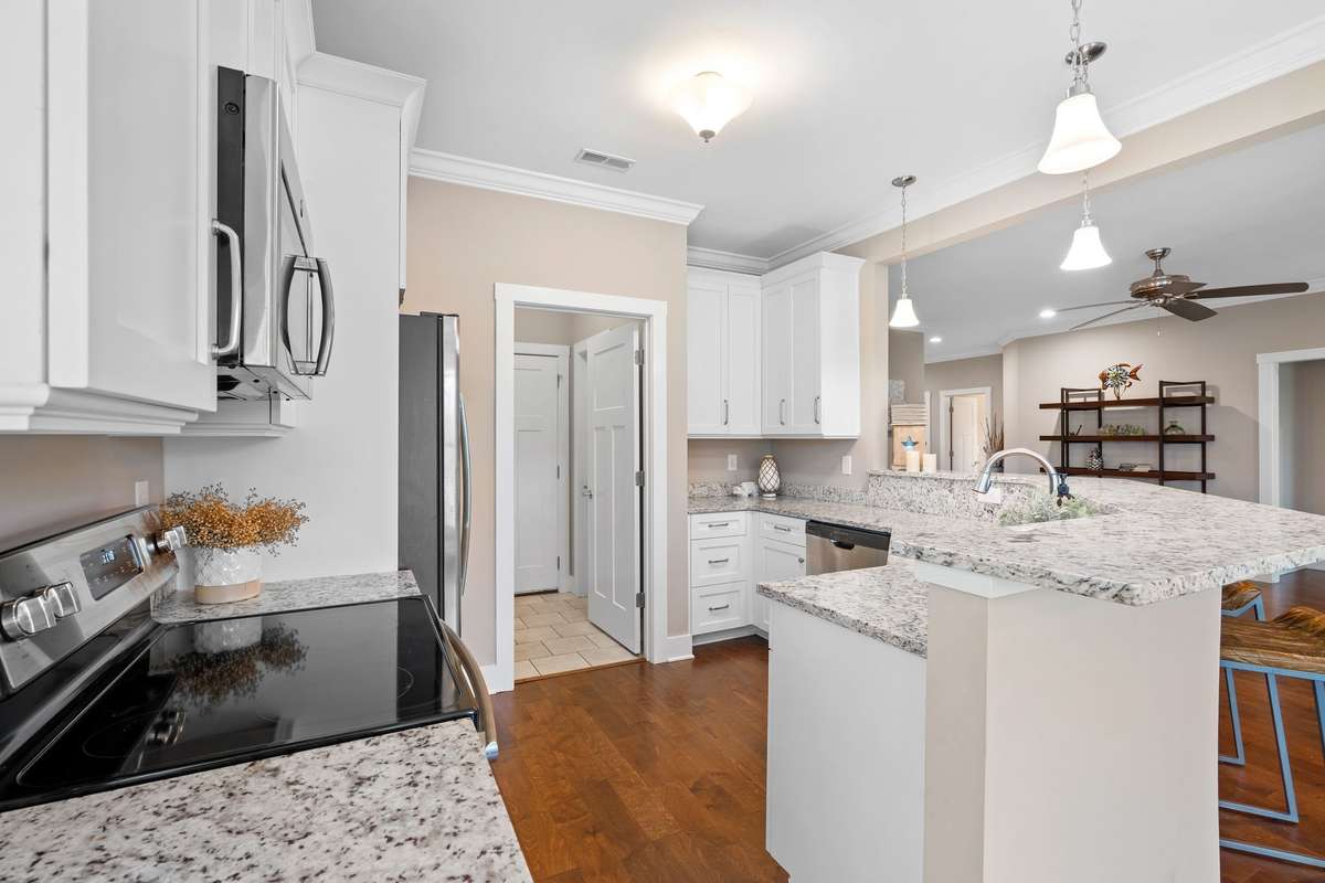 Granite countertops, stainless appliances, and open layout ideal for entertaining.