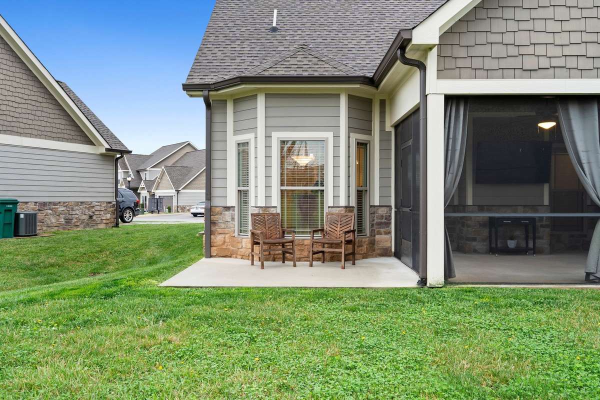Private patio area adjacent to the screened porch, perfect for morning coffee or evening relaxation.