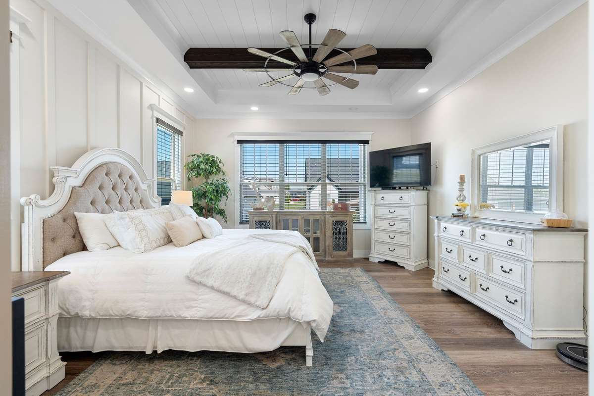 Beautifully designed primary suite offering comfort, space, and natural light throughout.