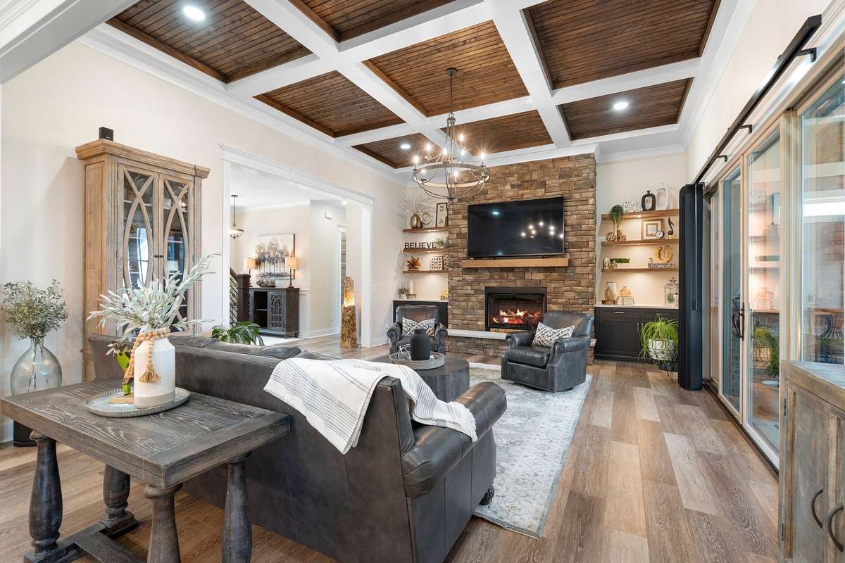 Striking stone fireplace with built-ins and custom shelving—anchoring the living space with style and warmth.