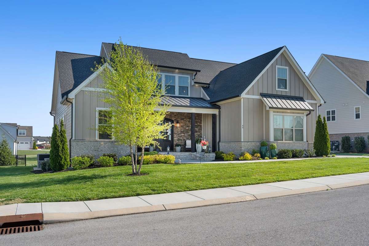 Thoughtfully designed home with inviting front porch and exceptional attention to detail throughout.