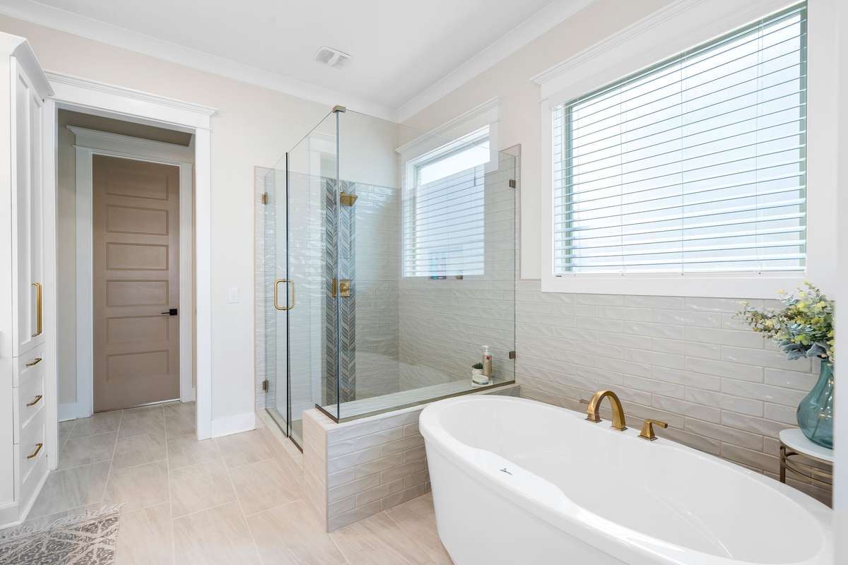 Freestanding soaking tub offering a relaxing retreat within the primary suite.