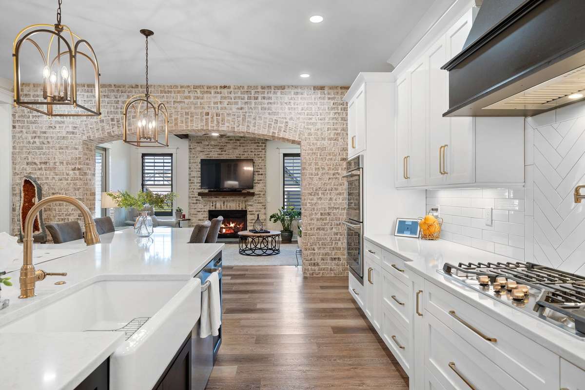 Open sightlines from kitchen to living room create a connected, welcoming atmosphere.