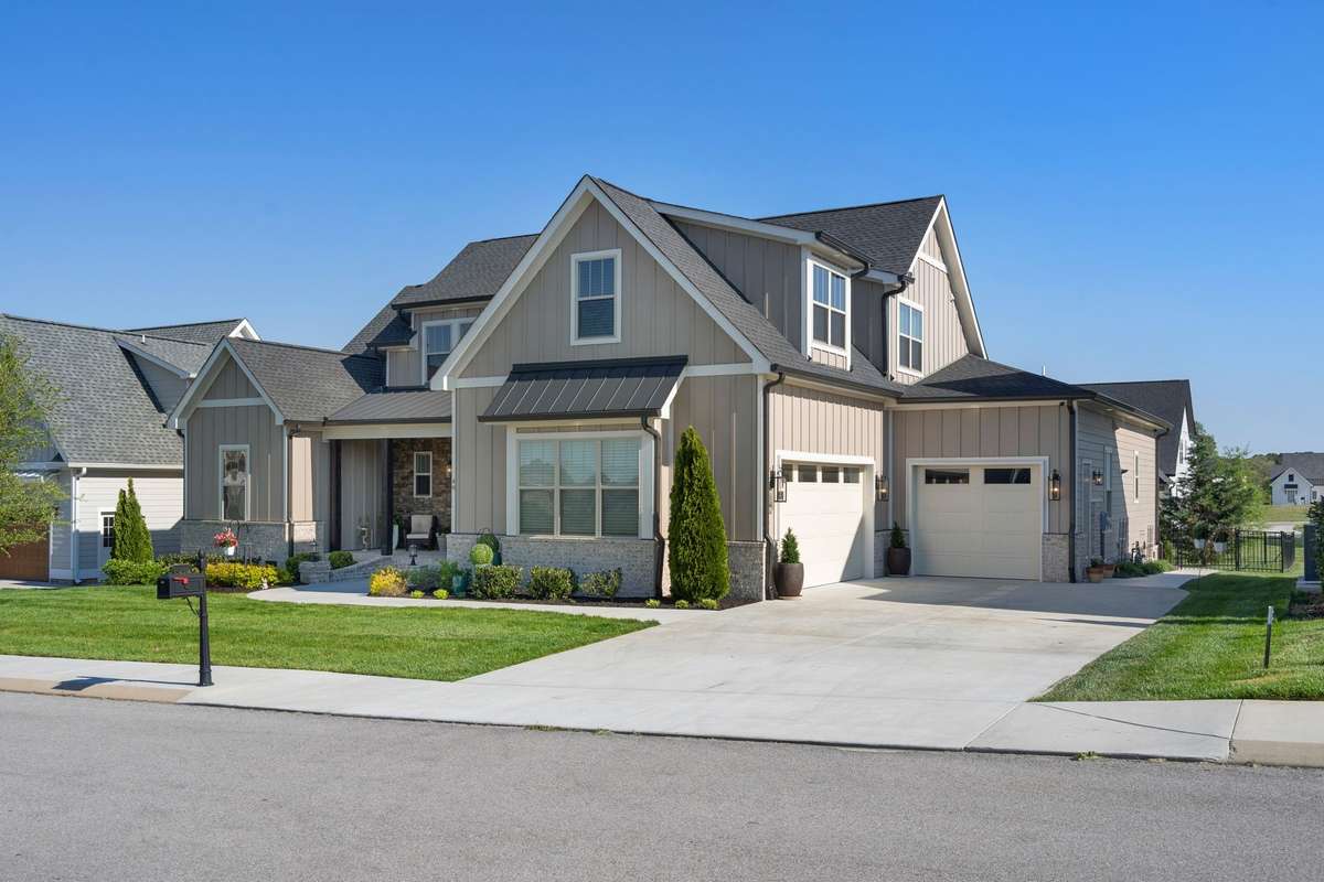 Spacious side-entry 3-car garage with extended driveway—offering both functionality and clean architectural appeal.