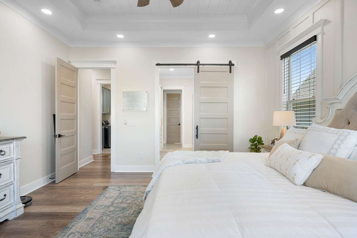 Seamless flow from the primary bedroom to the ensuite bath with elegant finishes and thoughtful design.