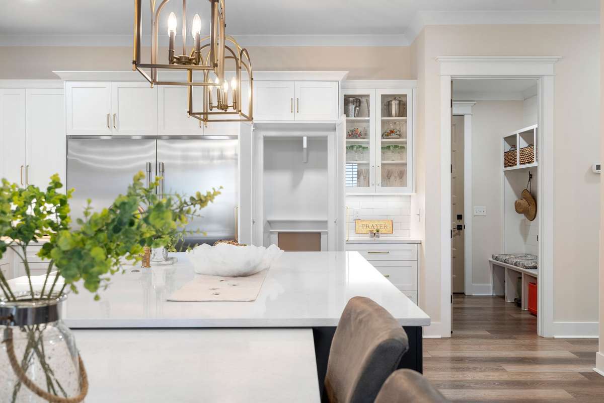 Convenient access to walk-in pantry and functional drop zone area for everyday organization.