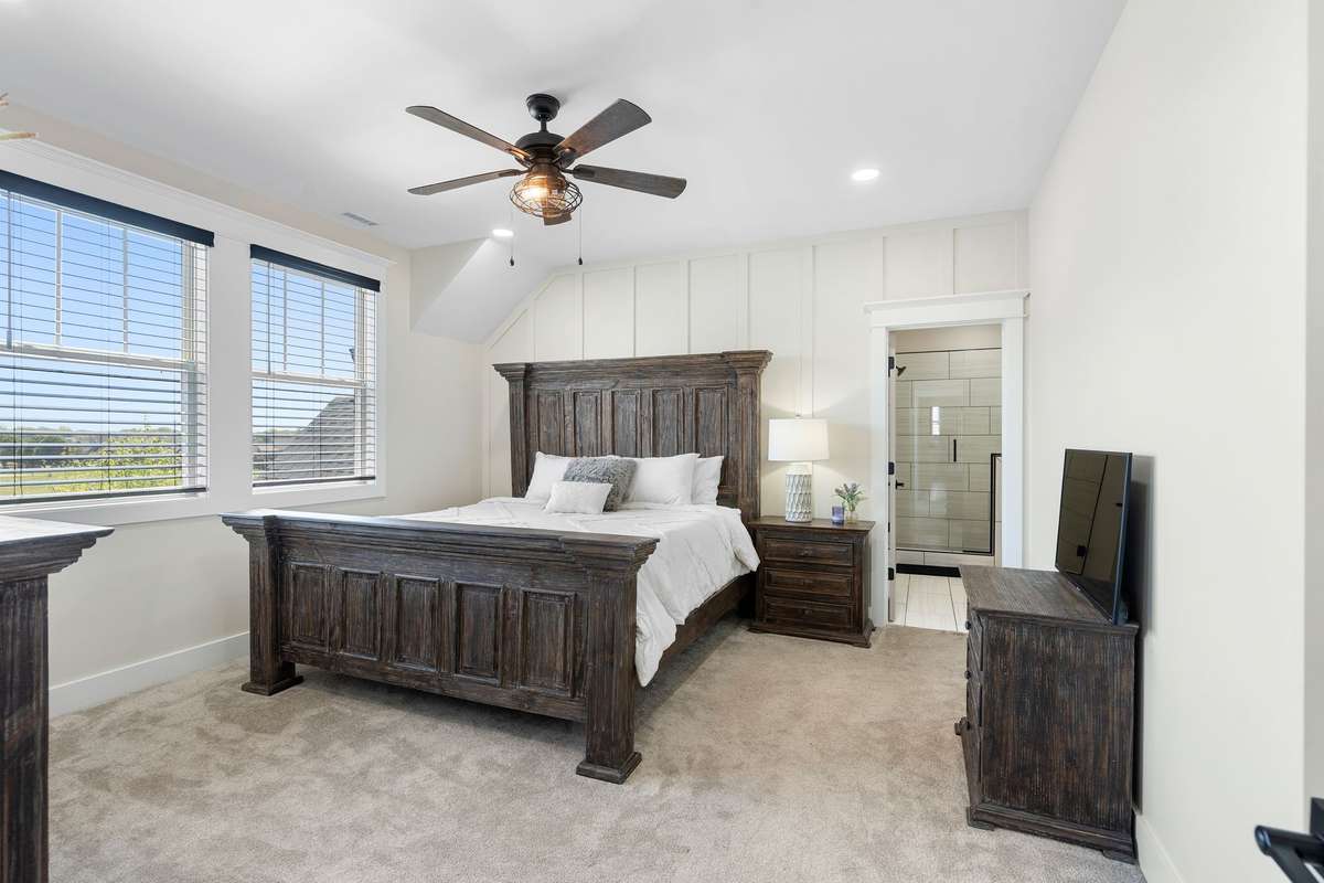 Well-appointed guest bedroom with neutral tones and inviting design.