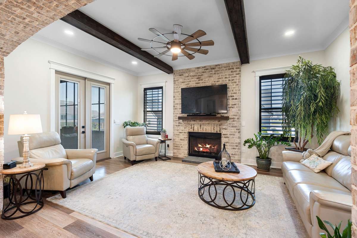 Warm and welcoming gathering space centered around a gas fireplace—perfect for relaxing or entertaining.