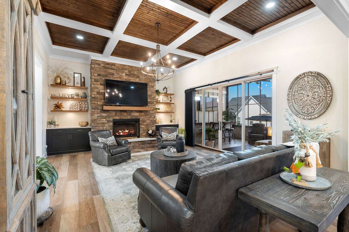 Indoor-outdoor living at its best—sliding doors open to a screened porch for year-round enjoyment.