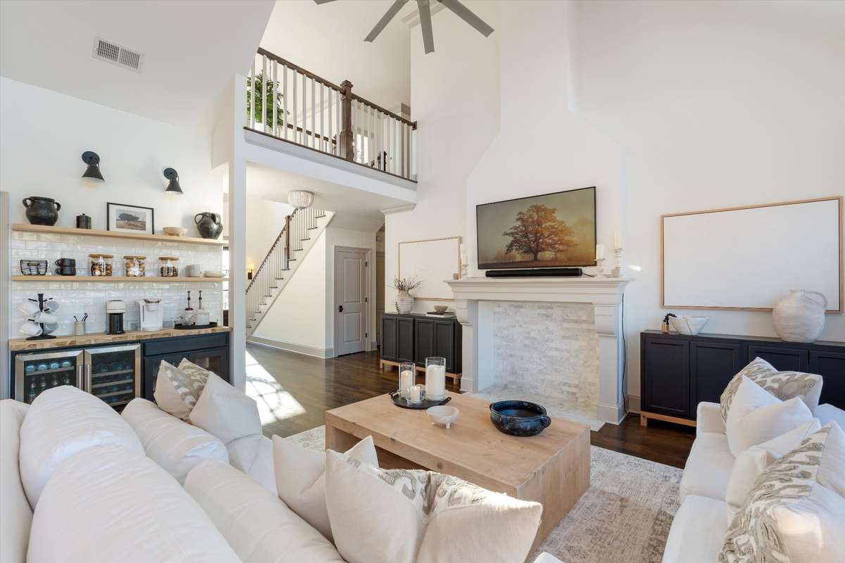 Marble fireplace, coffee bar with double built in beverage fridge