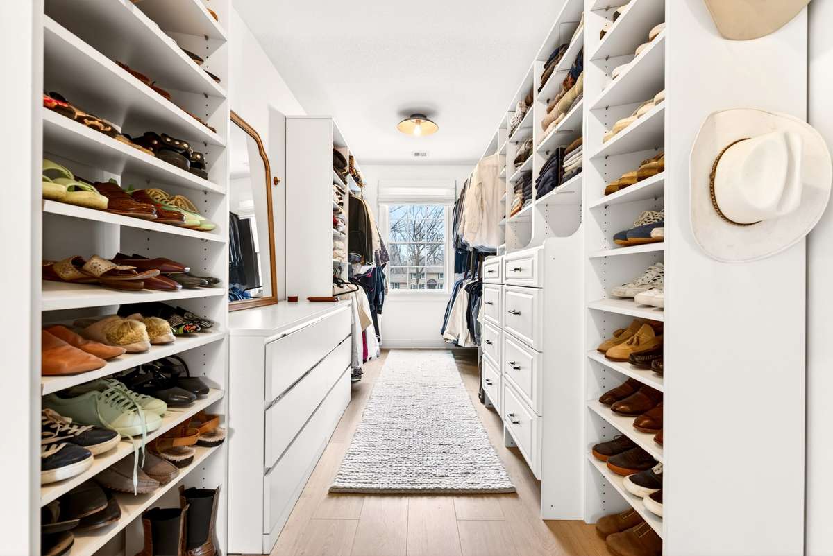 Upstairs 2nd Primary Suite Walk-in Closets with Upgraded Built-in Cabinetry.