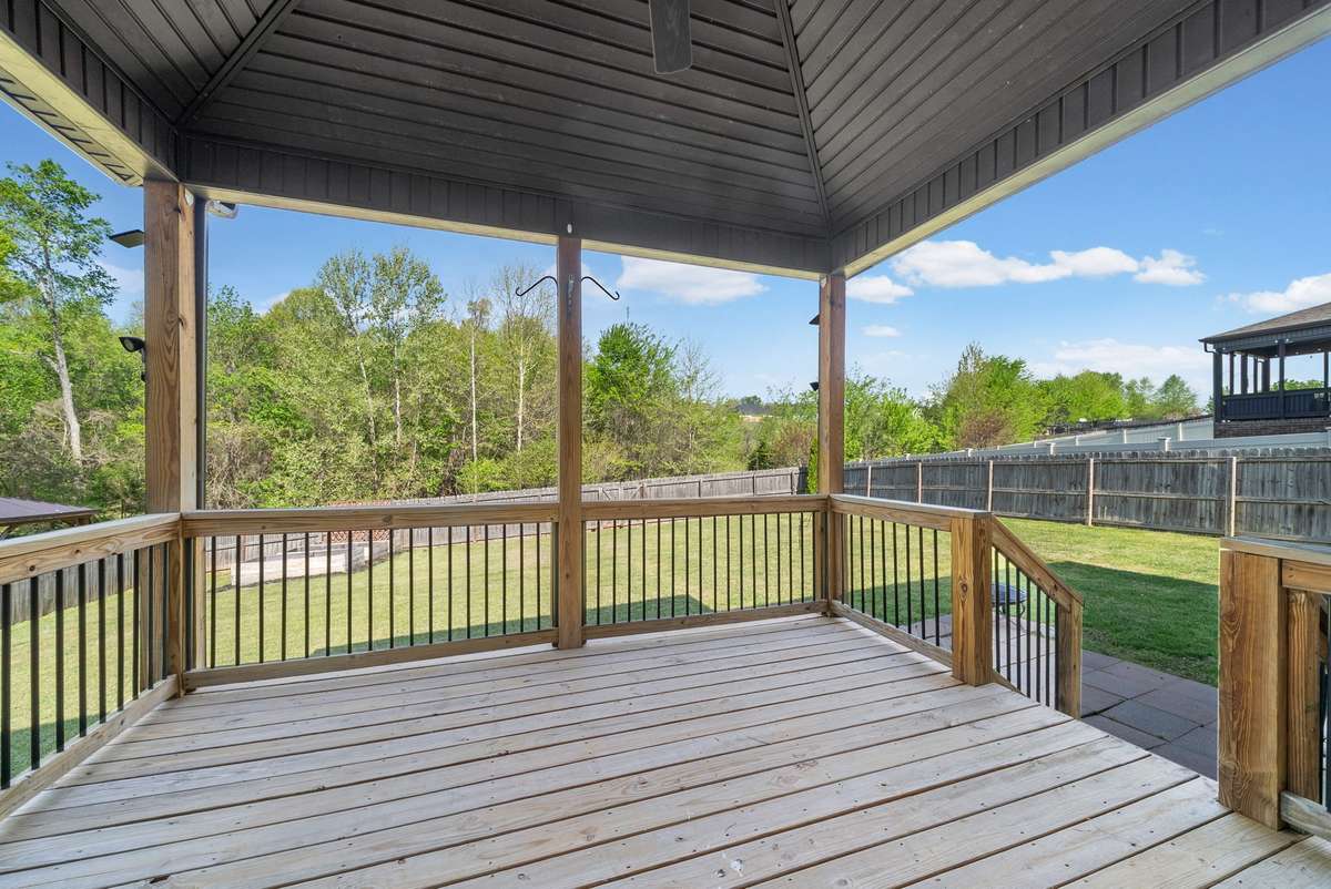 Covered deck with ceiling fan. Just pressure washed for you!
