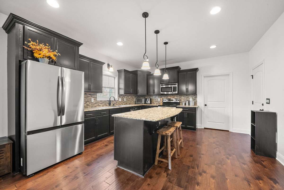 Large kitchen with granite counters