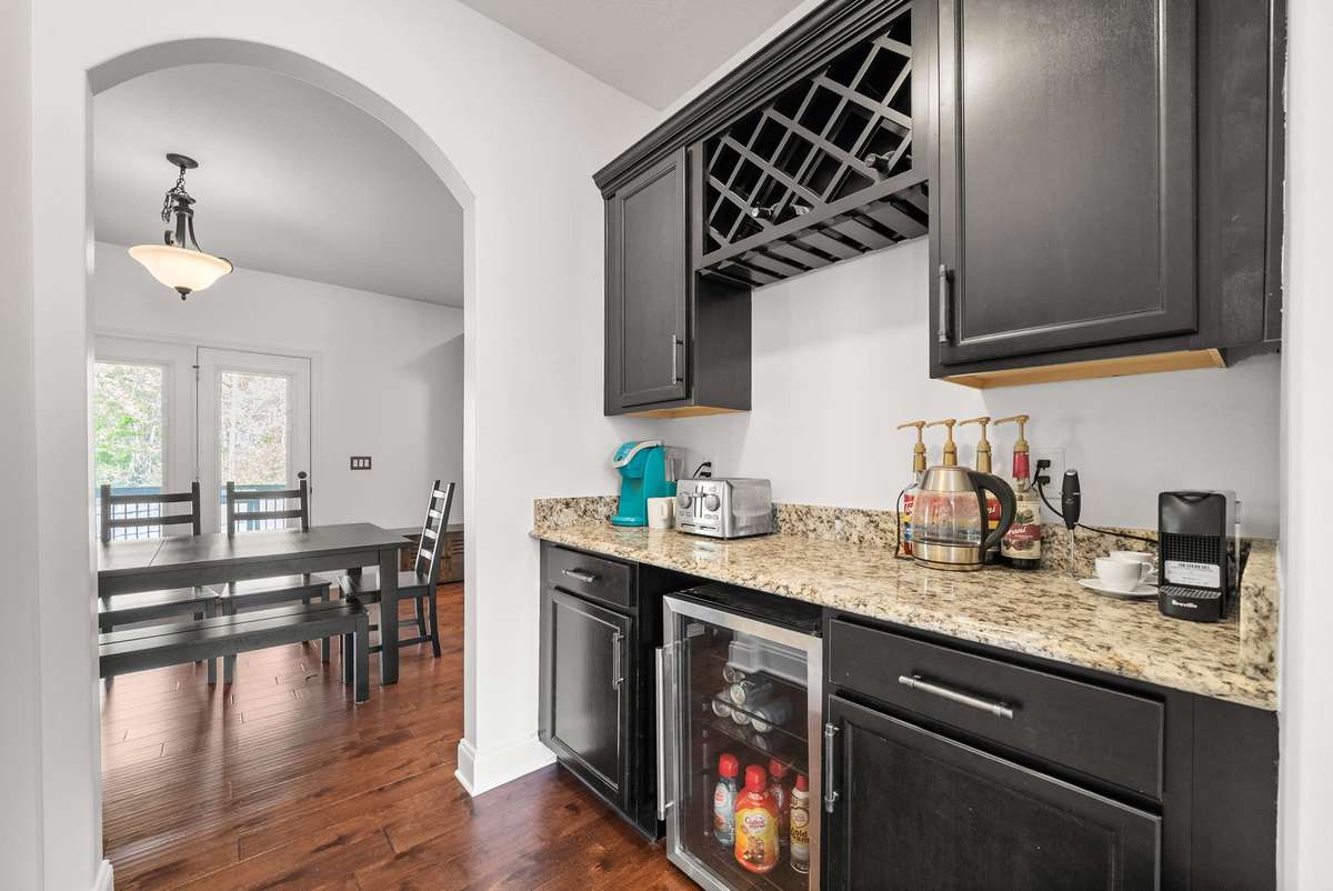 Butler's pantry with wine bar and granite counters! (Fridge does not convey)