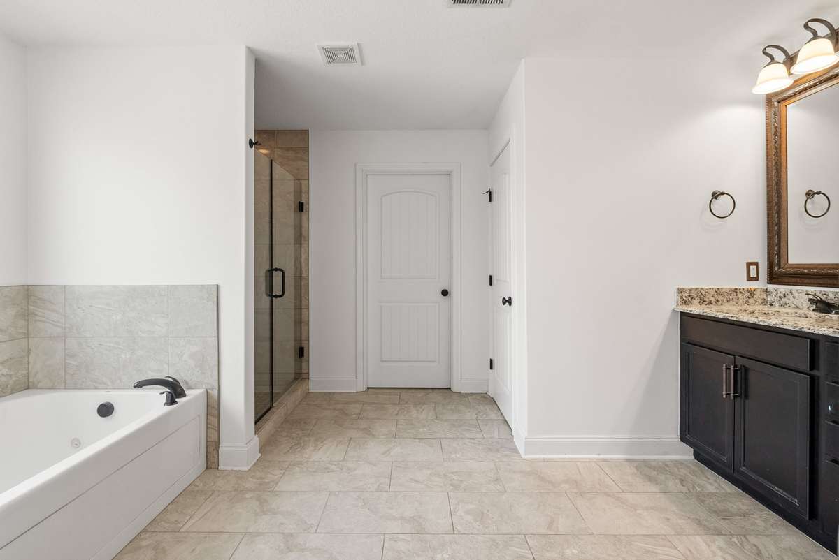Large en suite bath with tile floors!