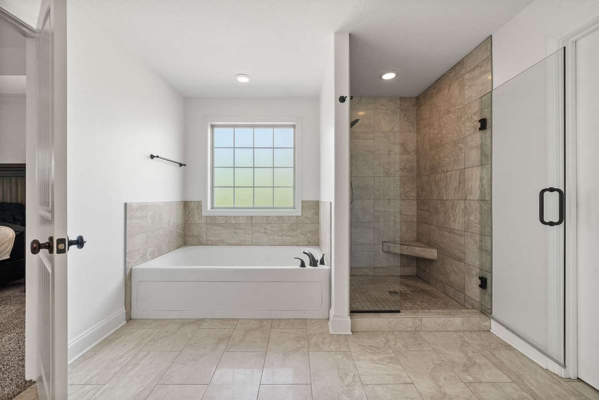 Large soaking tub and tile shower with glass doors!
