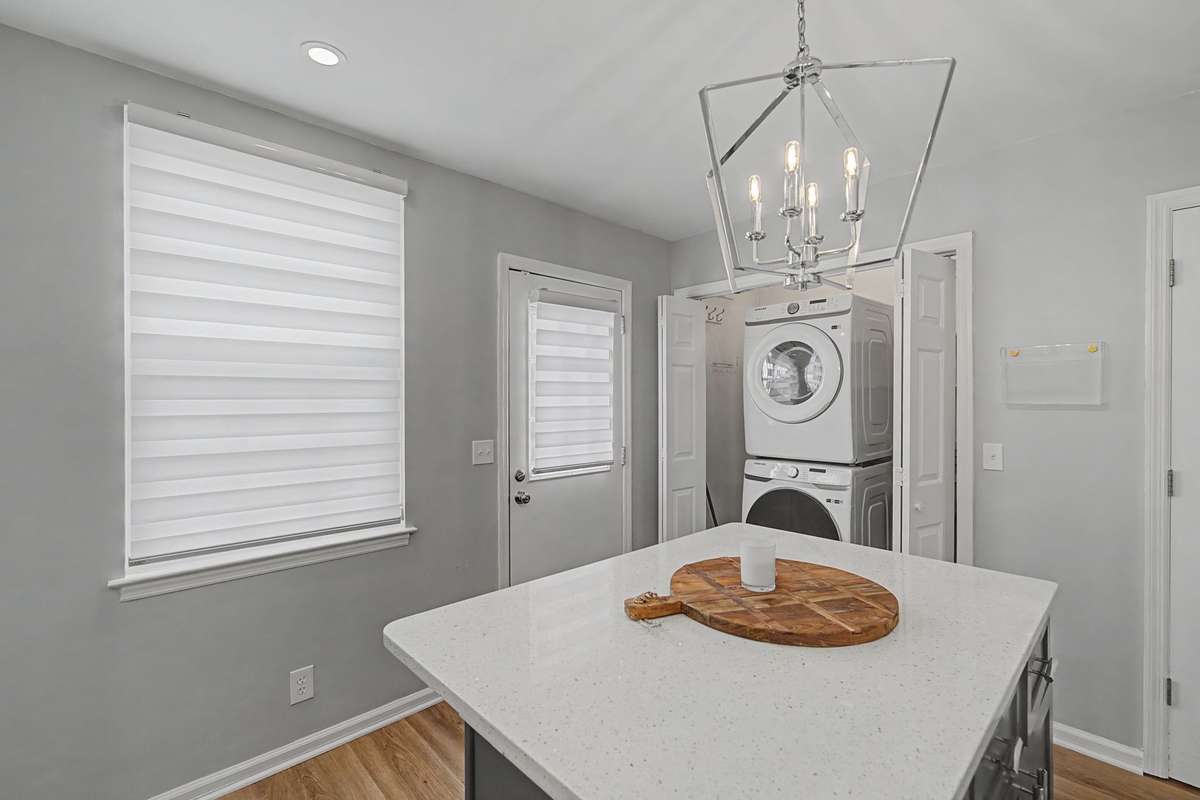 The washer and dryer are conveniently situated in the kitchen, allowing you to multitask if necessary and maintain a quiet environment for those sleeping upstairs.