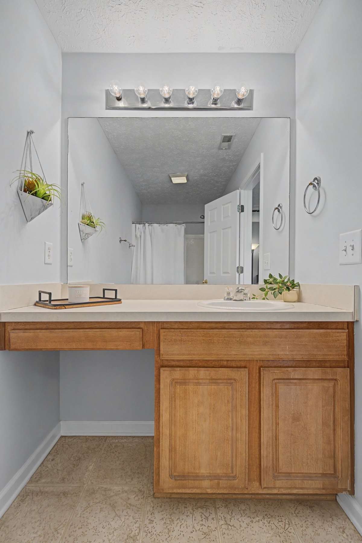 The primary bathroom vanity features a single sink and MAKE-UP area.