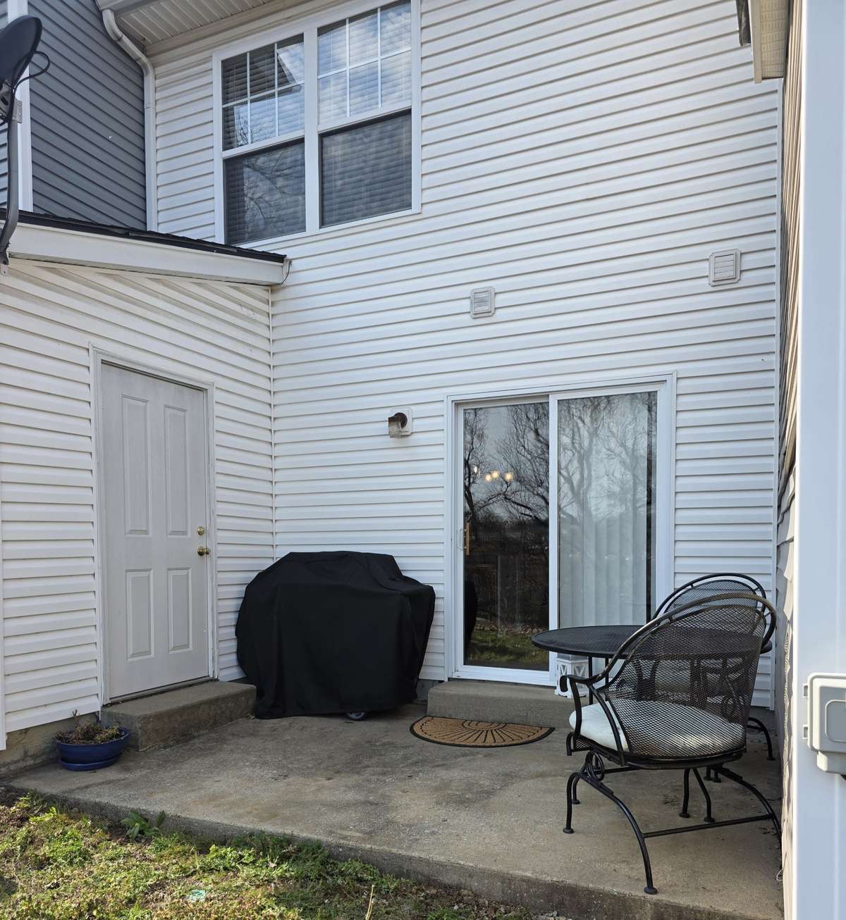 Back open patio is large enough for a table/chairs and grill.  Also, there is a STORAGE CLOSET you can utilize.