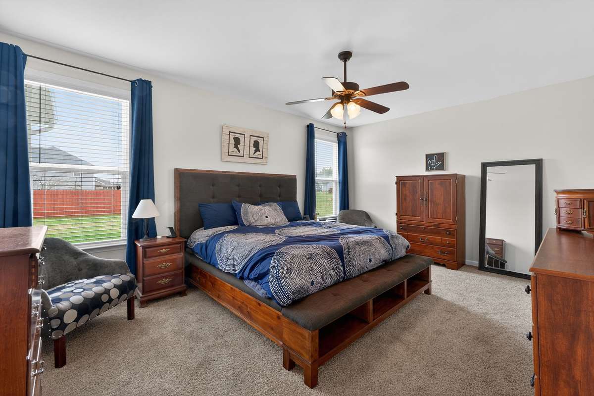 Primary suite on main floor with beautiful light from windows