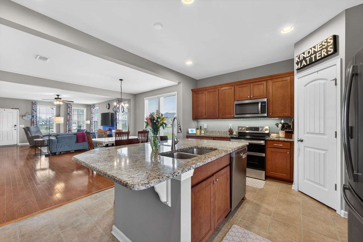 Recessed lighting with dimmer and under cabinet lighting in cooking area.