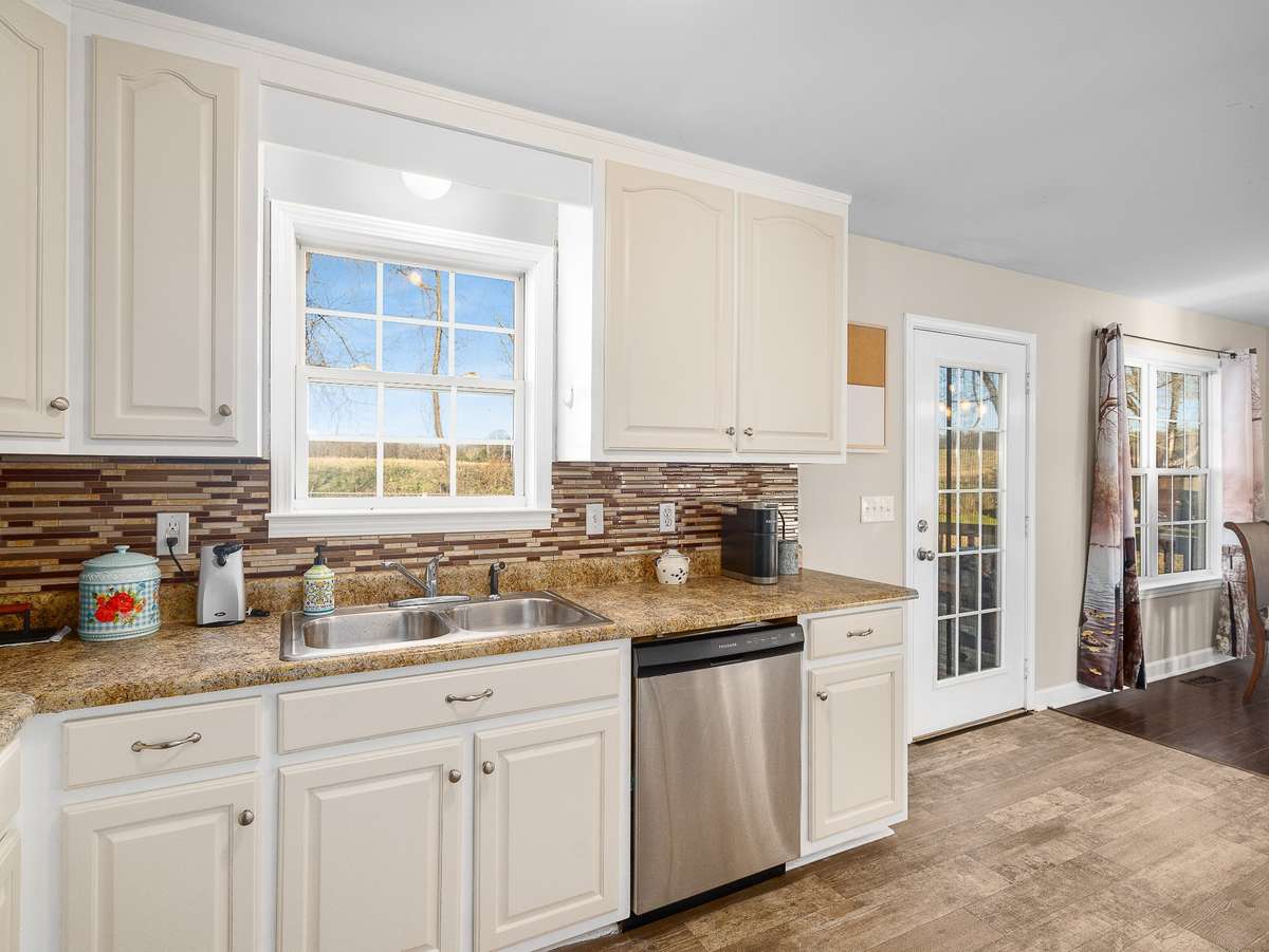 Freshly painted kitchen cabinets with stainless steel appliances