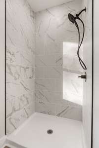 Primary Bathroom with tile shower