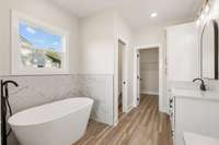 Primary Bathroom with access to water closet and bedroom closet