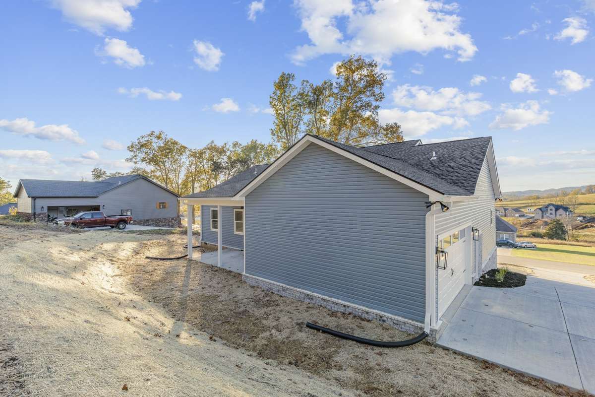 Rear of Home with 2 car garage