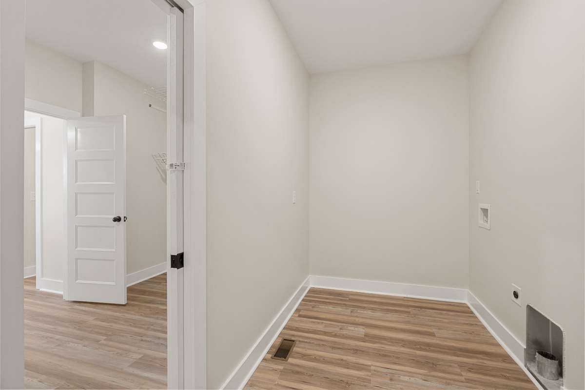 Laundry Room with access to Primary Bedroom Closet