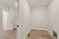 Laundry Room with access to Primary Bedroom Closet