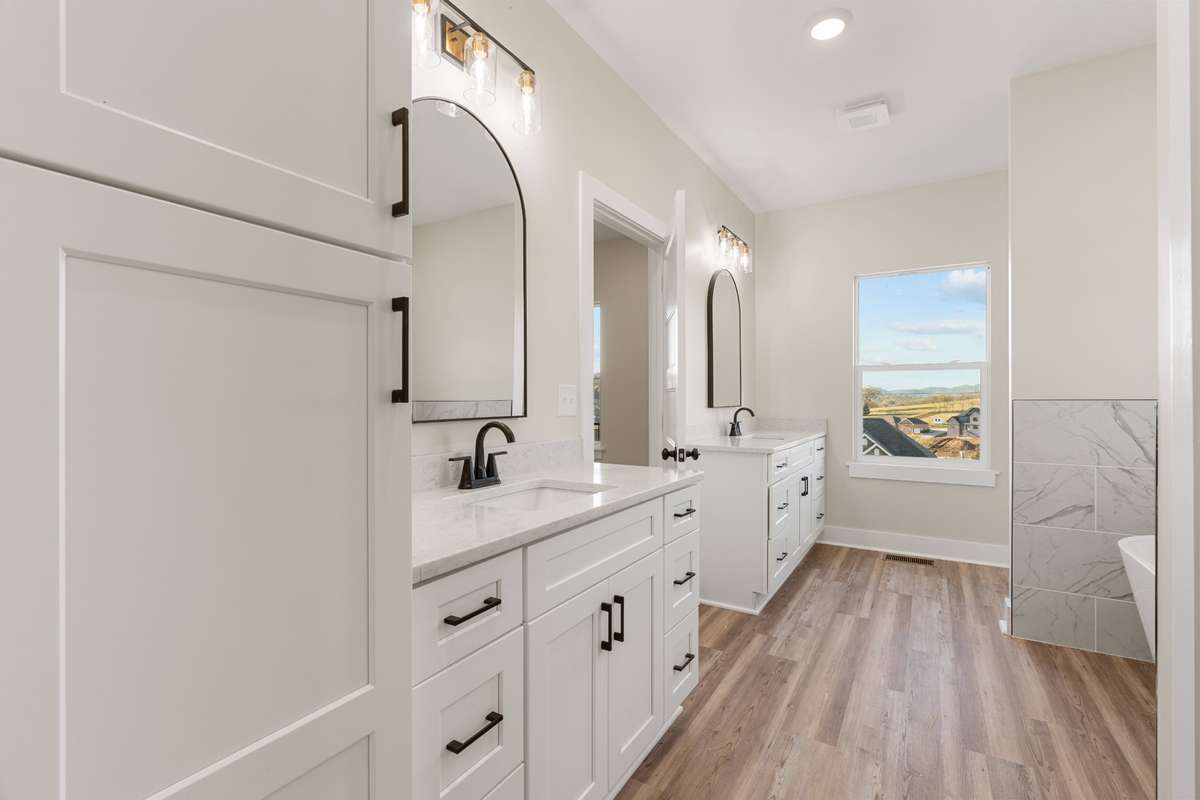 Primary Bathroom, double Vanity with linen cabinet