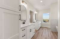 Primary Bathroom, double Vanity with linen cabinet