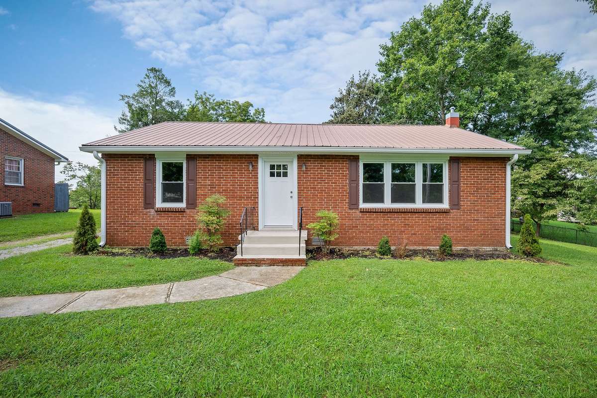The home has new doors, windows, shutters, gutters/soffit, landscaping, and the porches have been painted.