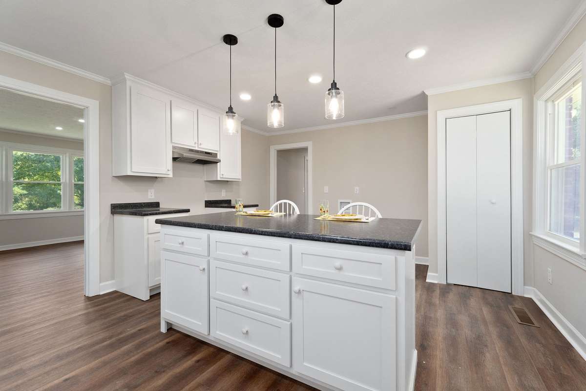 The natural light coming into the room makes this kitchen a great place to meet with friends.