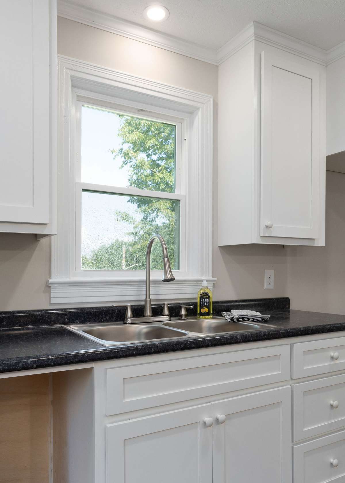 The kitchen has a new sink and faucet.