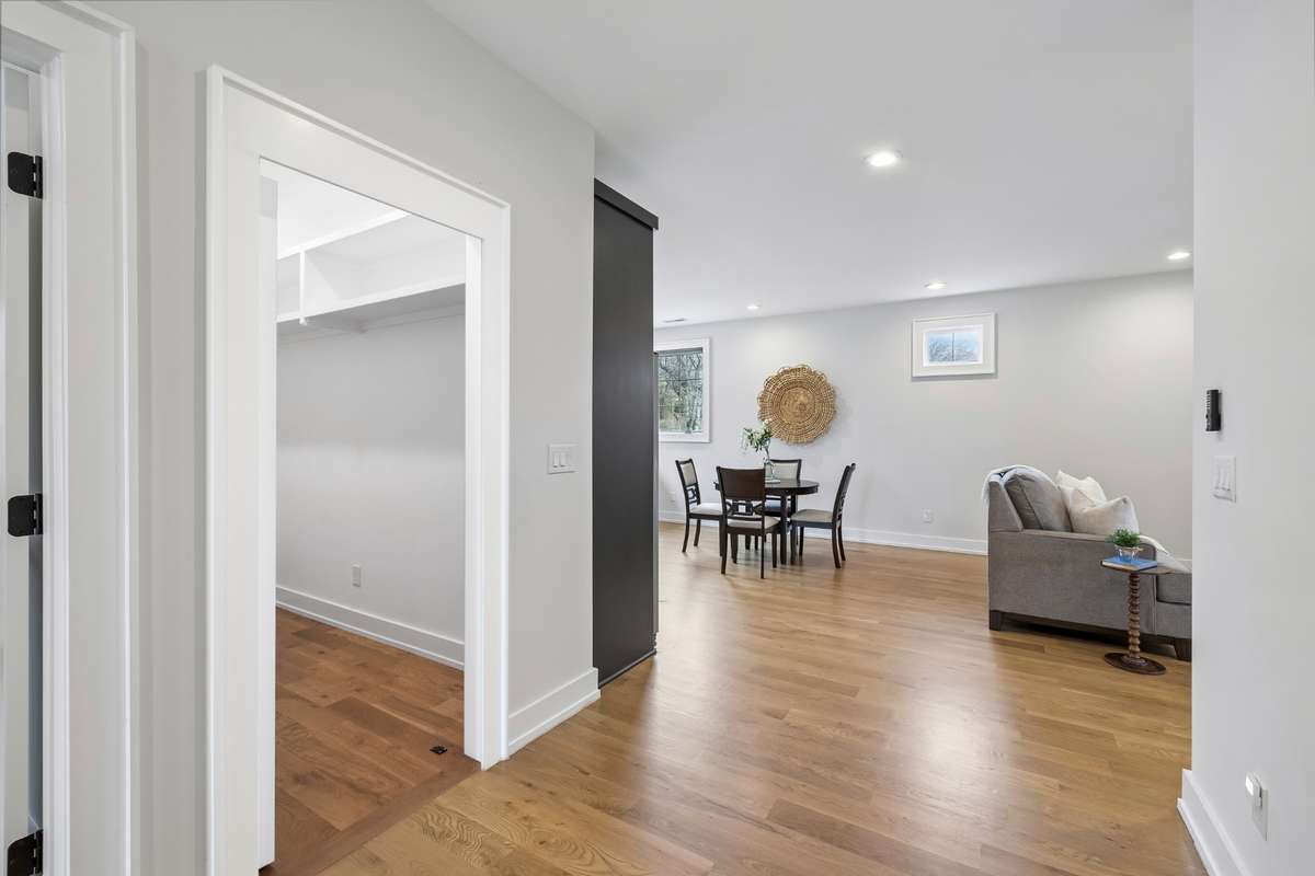Behind the bookcase is a hidden oversized storage closet.