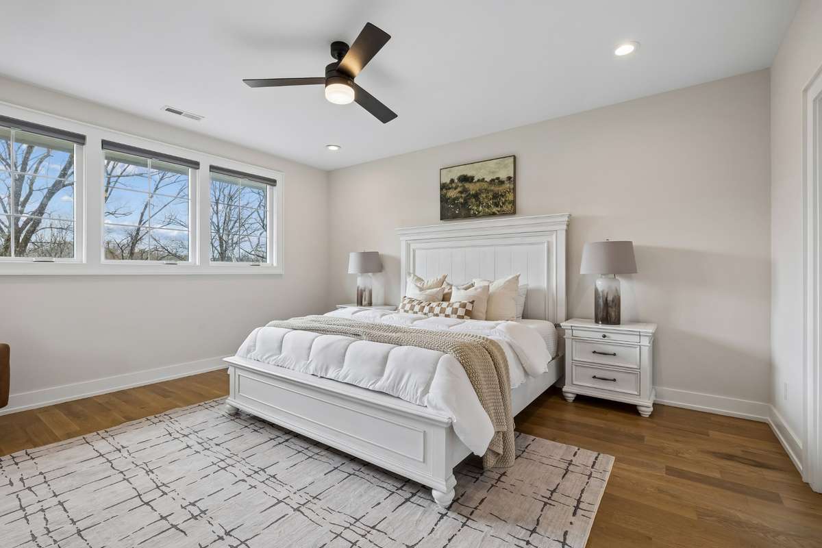 Second floor primary suite is situated treehouse style with beautiful greenery from every vantage point.