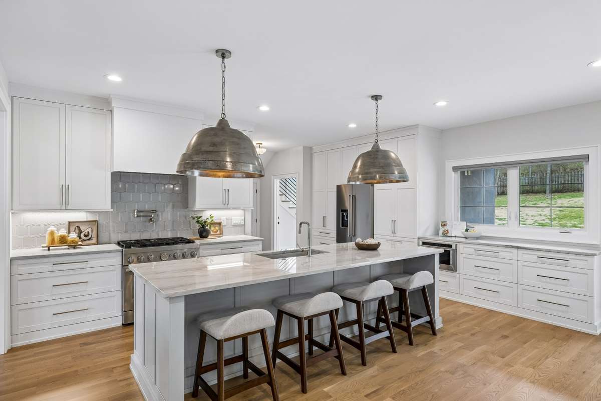 The kitchen was designed with functionality in mind, outfitted with KitchenAid appliances, quartzite countertops and tons of extra storage.