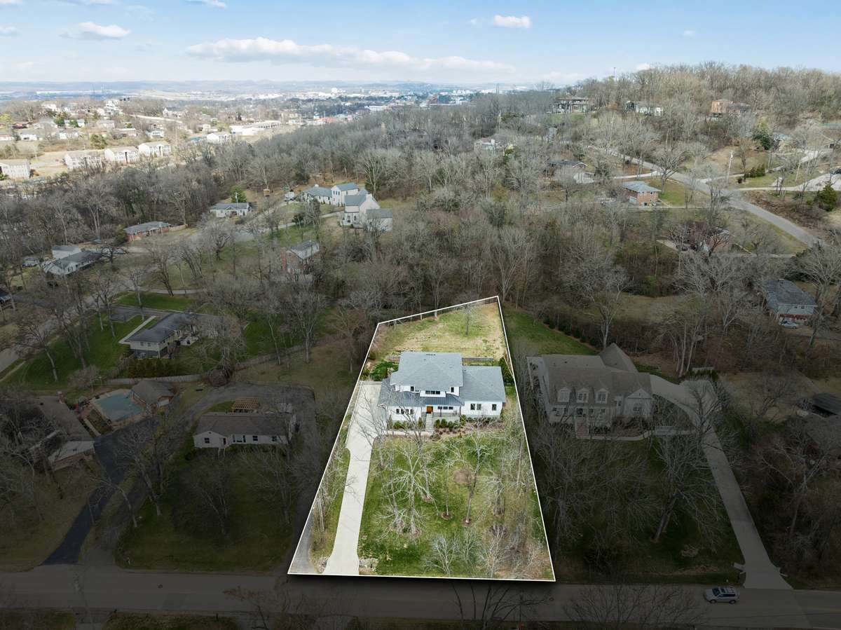 Drone shot from above, property line actually goes further back than highlighted area. Seller stopped fence before end of property line for shaded privacy offered by wooded area behind the house.