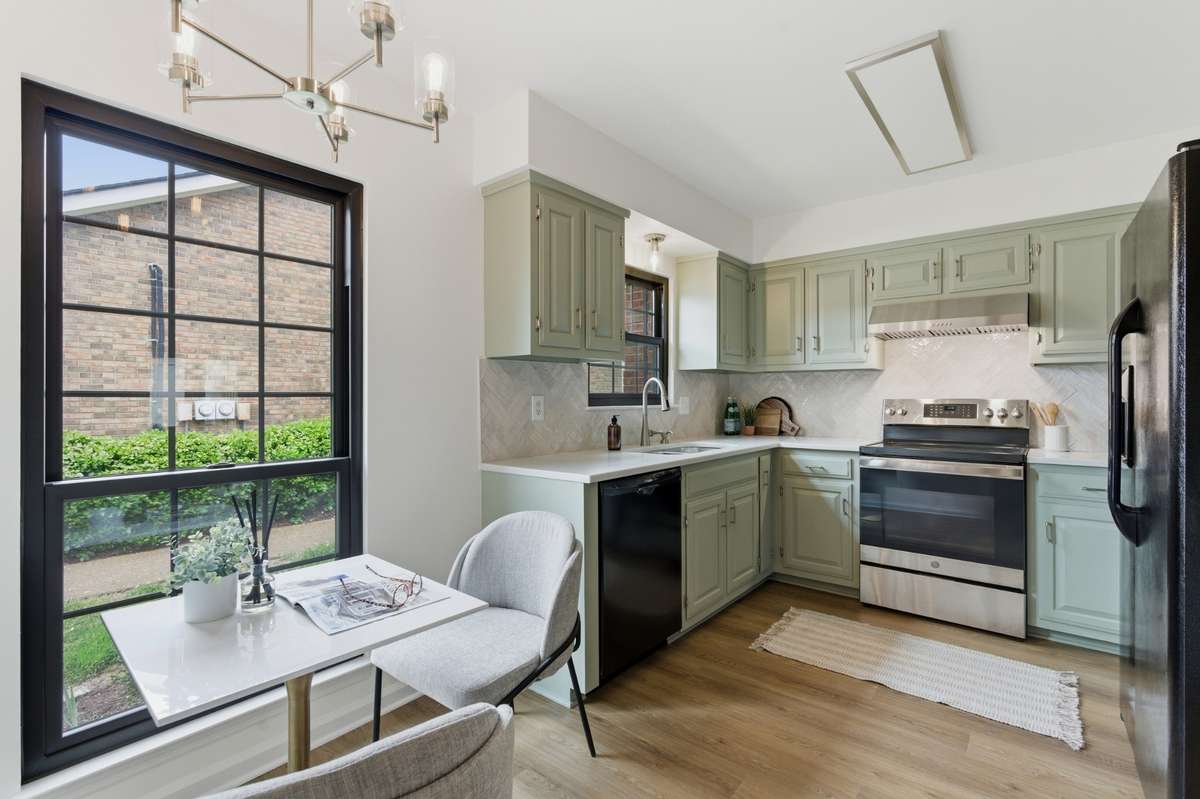 Gorgeous new kitchen! New quartz countertops, newly tiled backsplash, lighting, plumbing fixtures; fresh paint and  new flooring throughout the home.