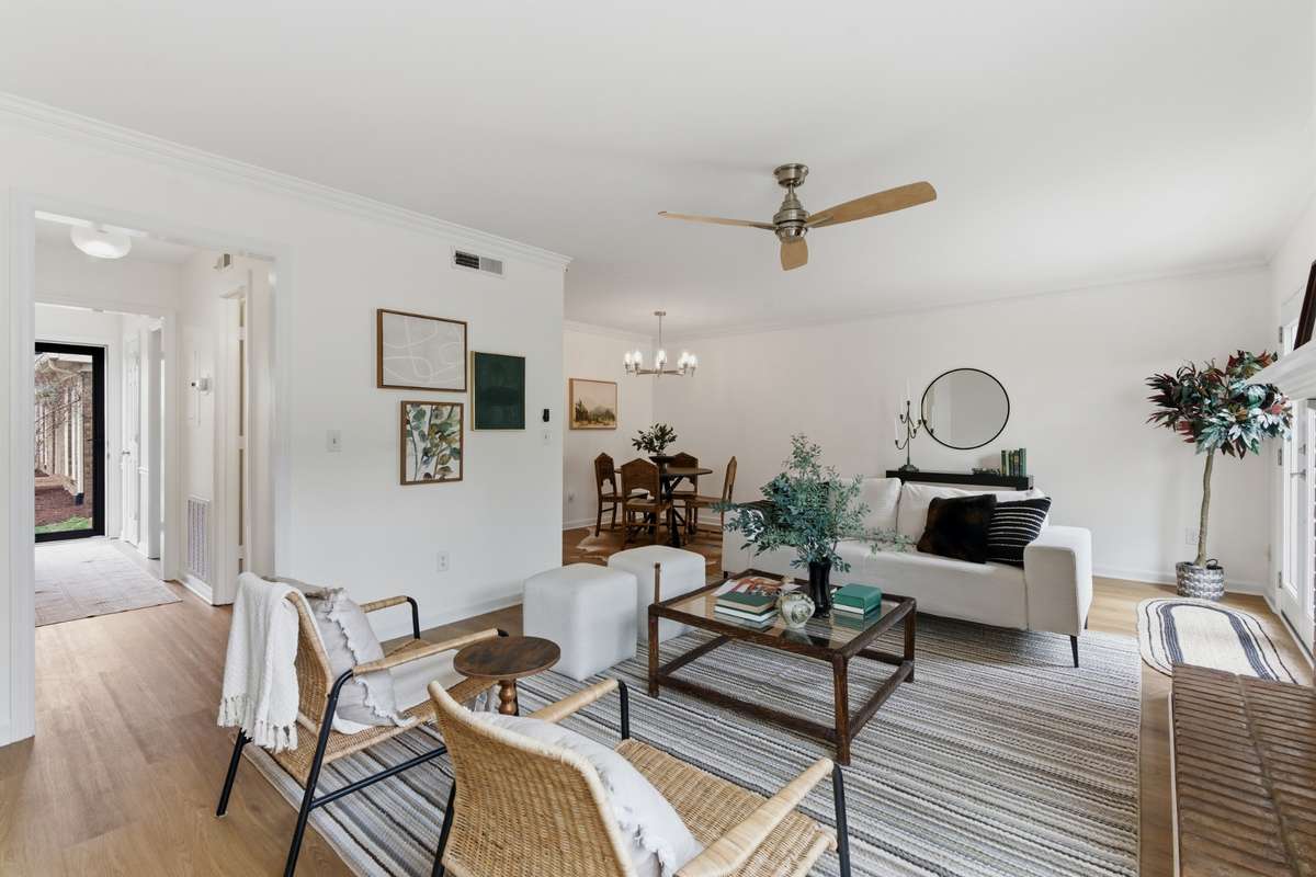 Photos don't do this space justice-the expansive living room can handle your largest sectional sofa or can easily add an office area.