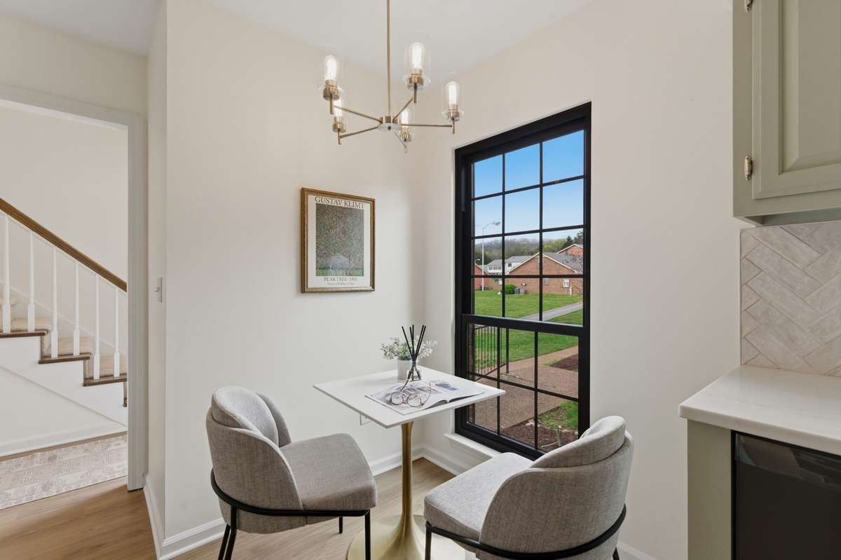 The loveliest breakfast nook by the oversized window--the perfect place for your morning coffee!