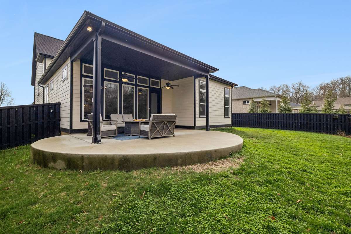 Custom Concrete Patio Expansion – Professionally installed radius (semi-circular) patio extension added to the existing patio, creating a larger outdoor living and entertaining area.