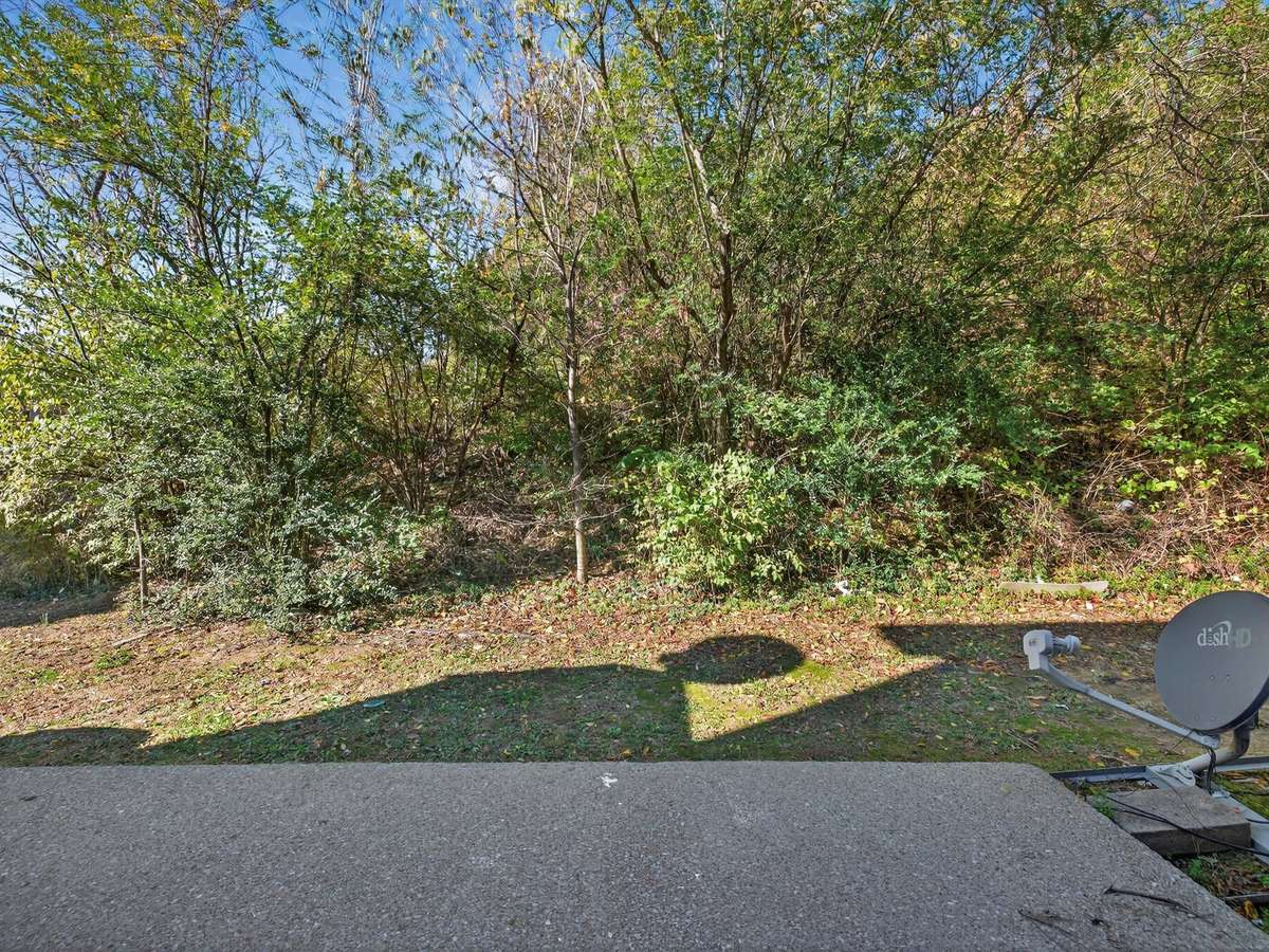 Back patio faces private wooded views