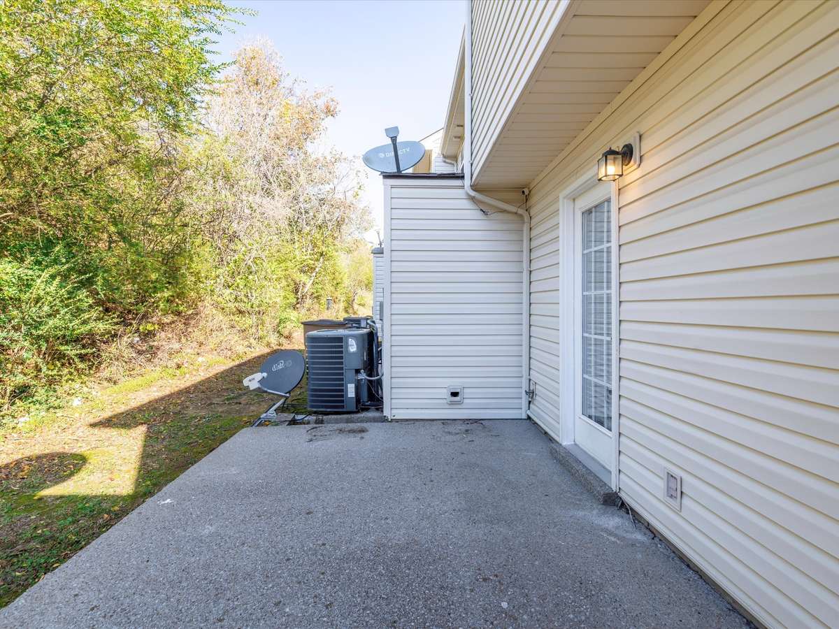 Back patio faces private wooded views