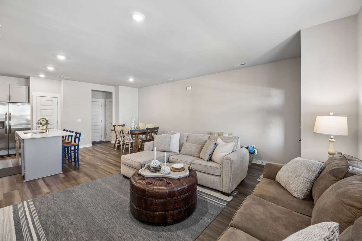 Open concept as living room joins the dining room and kitchen