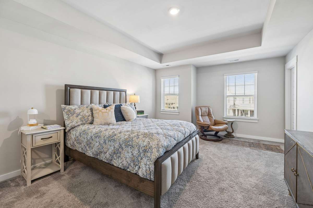 Primary bedroom with trey ceiling, huge walk-in closet and bathroom